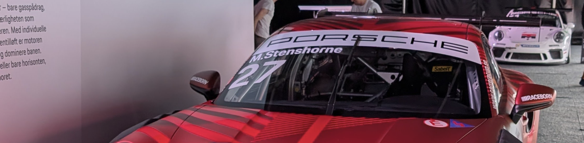 Wide cropped version of the porsche keeping the windshield in the image