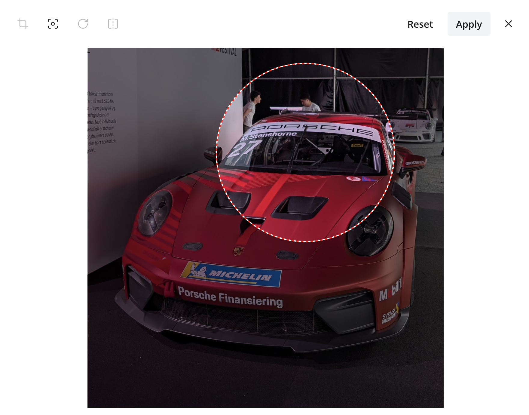 Image editor in focal-point mode with the windhield of a porsche selected as the focal area. The focal area is visualized as a circle that can be moved around inside the image