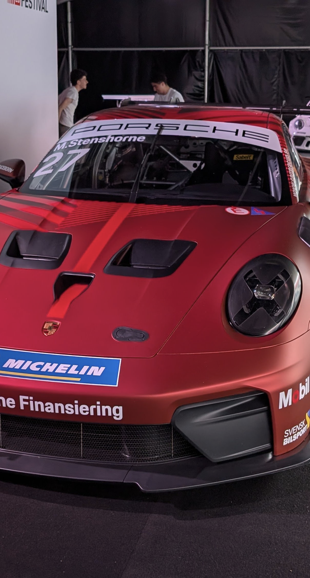 Tall crop of the porsche keeping the windshield in the image