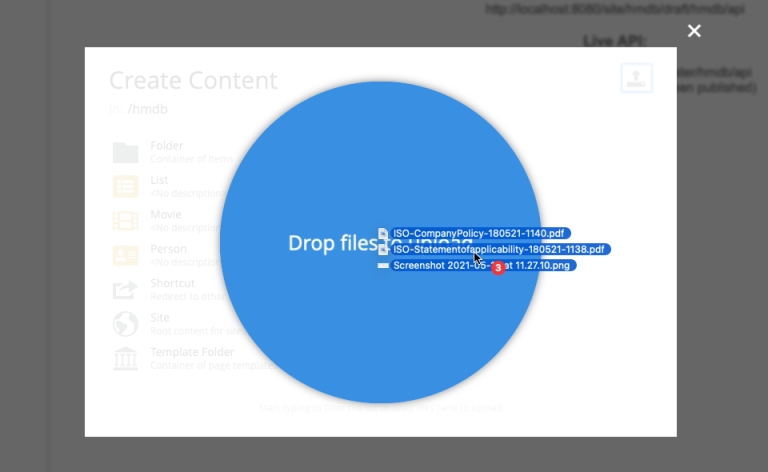 The drag and drop interface. Three file icons being dragged onto a large, blue, circular drop zone.